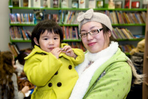 Mother holding small child in the Redmond Community Centre