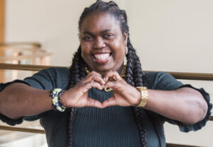 Lady making heart shape with her hands