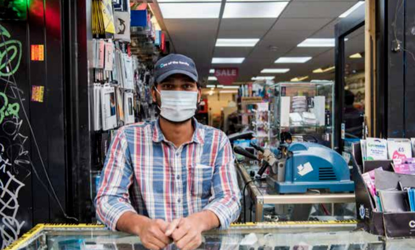 Shop owner wearing a mask