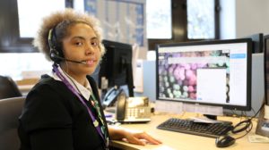 Apprentice sitting at a desk in the call centre