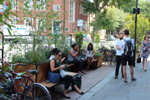 People sitting in Calvert Avenue, Shoreditch Parket